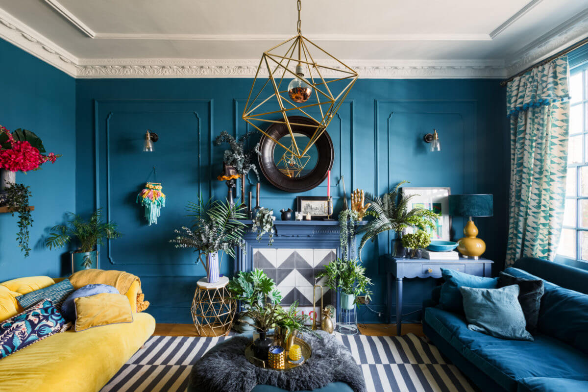 blue-sitting-room-striped-ikea-rug-fireplace-maximalist-home-london-nordroom