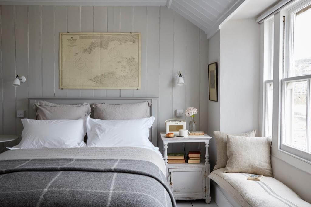cottage-bedroom-light-gray-walls-window-seat-nordroom