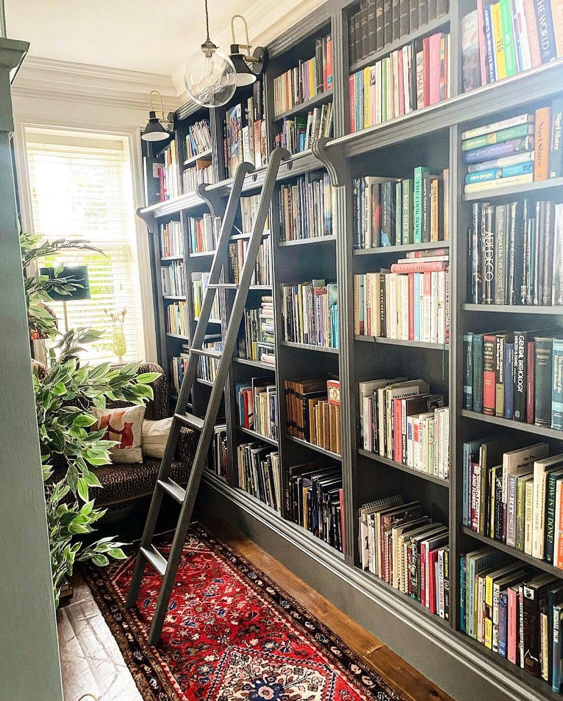 green-home-library-reading-nook-window-seat-red-vintage-rug-nordroom