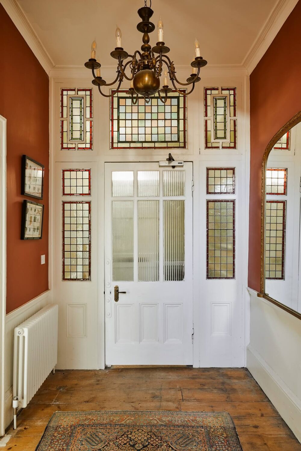 hallway-wooden-floor-red-walls-original-doors-nordroom