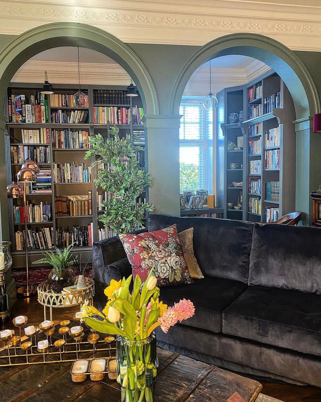 living-room-green-arches-bookshelves-nordroom