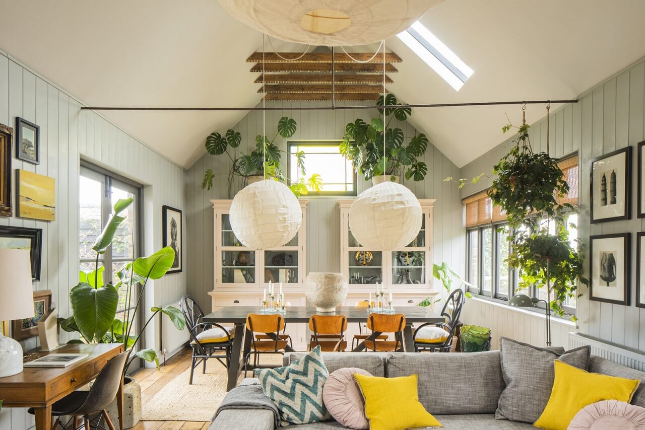 living-room-plants-exposed-beams-yellow-decor-nordroom