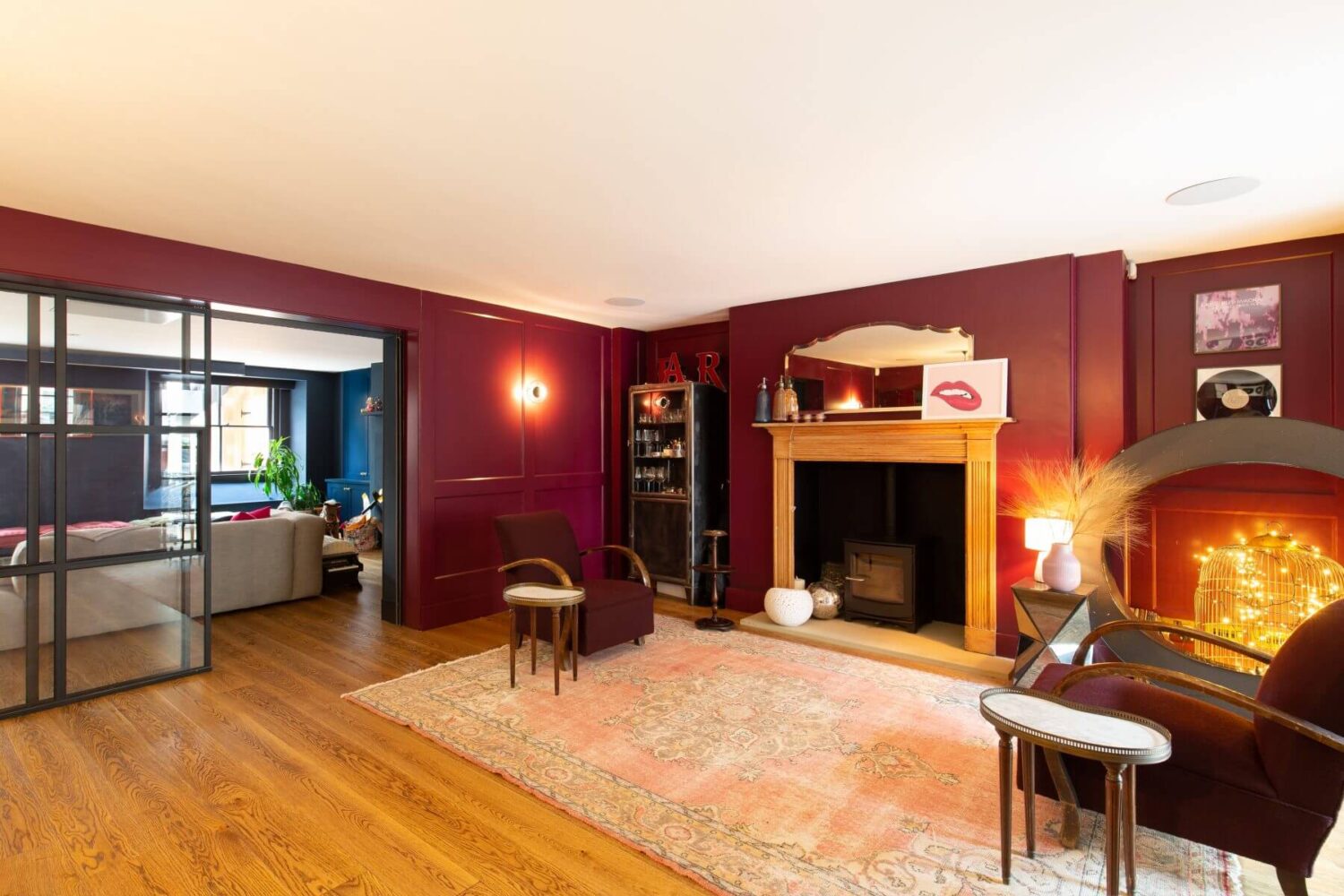 pink-bar-room-fireplace-wooden-floor-blue-play-room-nordroom