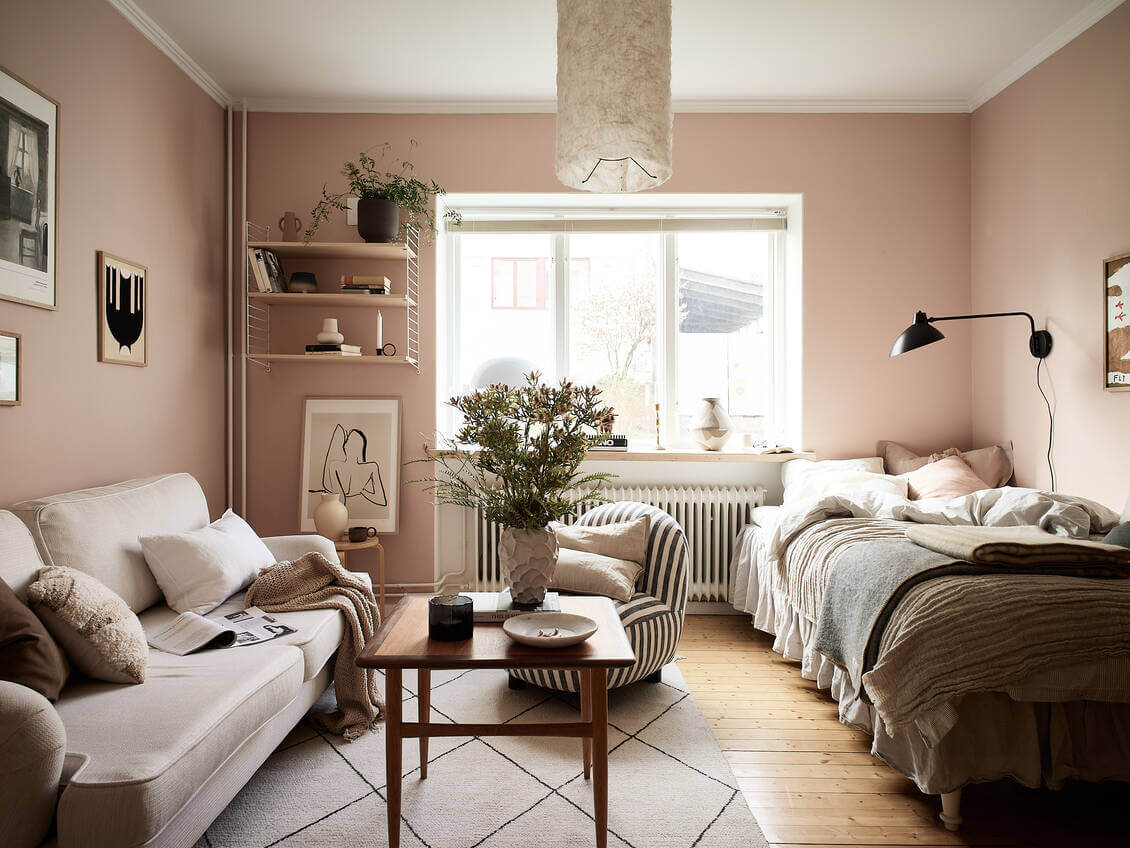 A Pink Studio Apartment with Green Bathroom