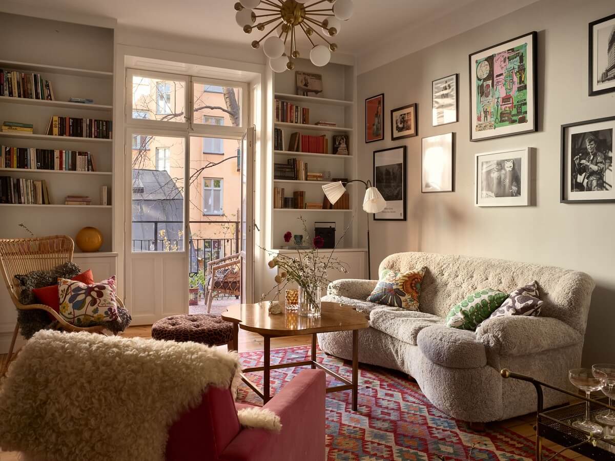 A Bedroom with Yellow French Wallpaper in a Small Scandi Home 1 sitting-room-curved-sofa-pink-rug-nordroom