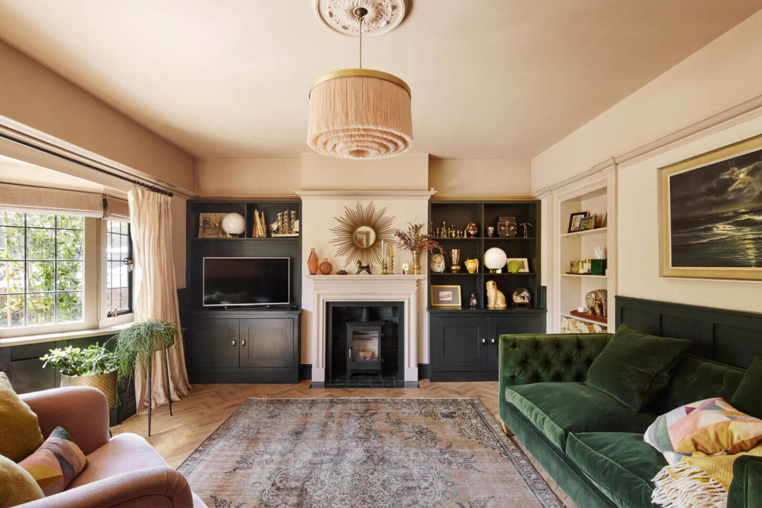 sitting-room-green-velvet-sofa-fireplace-bay-window-nordroom
