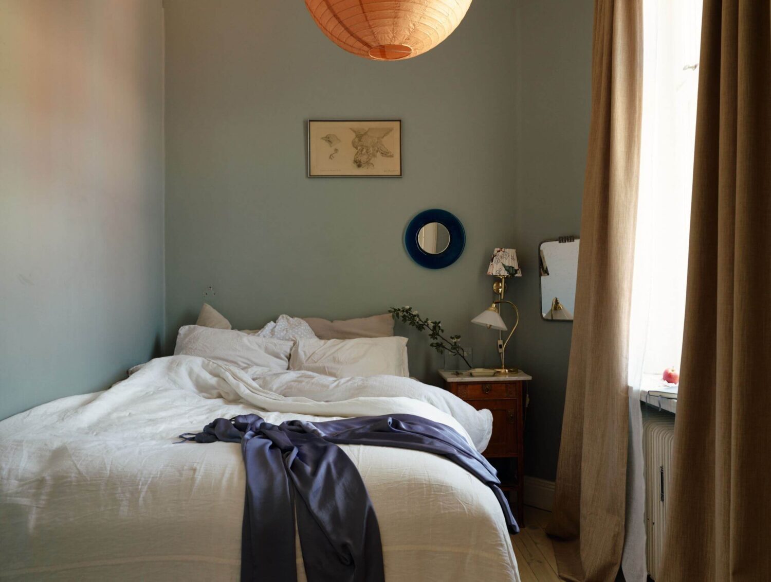 small-bedroom-muted-blue-walls-antique-nightstand-nordroom