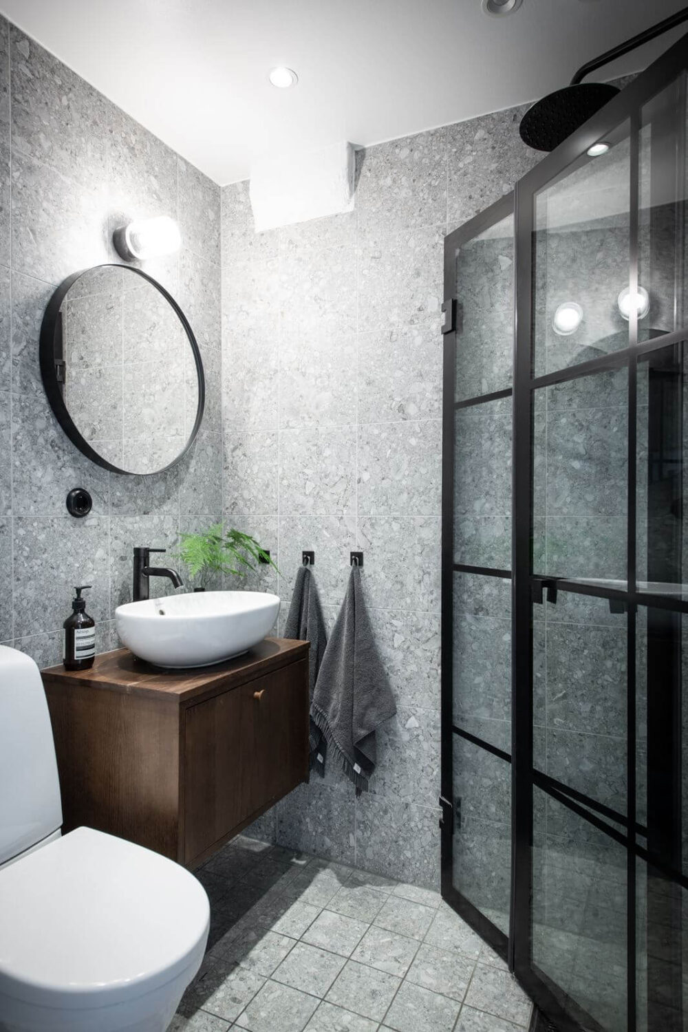 small-gray-bathroom-walnut-vanity-industrial-shower-door-nordroom