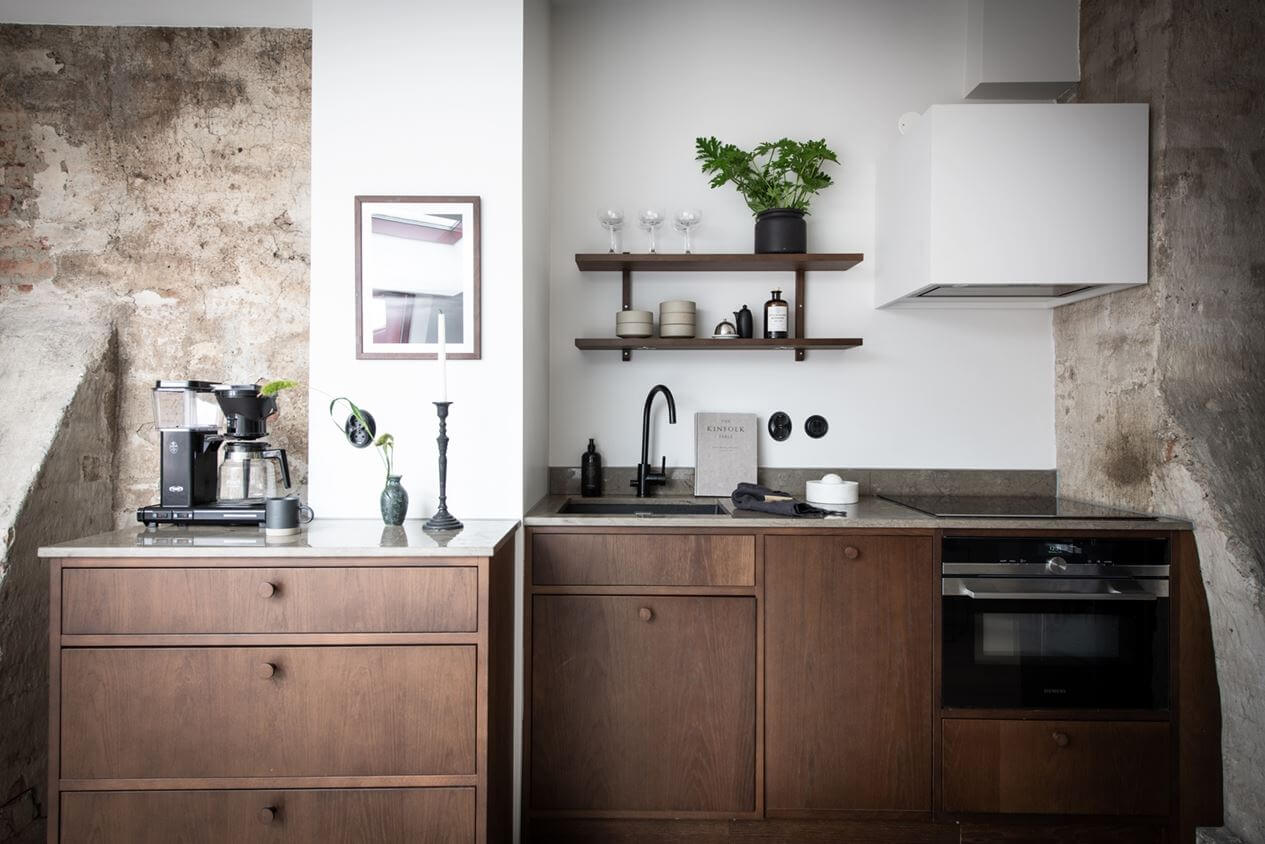 small-kitchen-walnut-cabinets-attic-apartment-sweden-nordroom