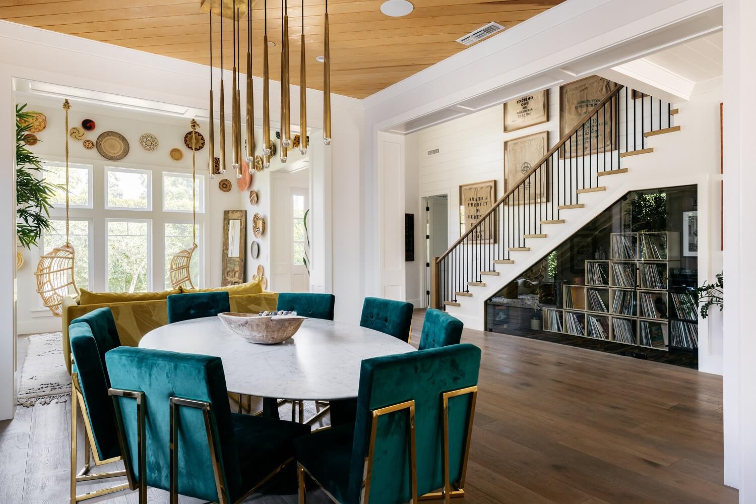 oval-dining-table-green-chairs-music-cabinets-daveed-diggs-emmy-raver-lampman-nordroom