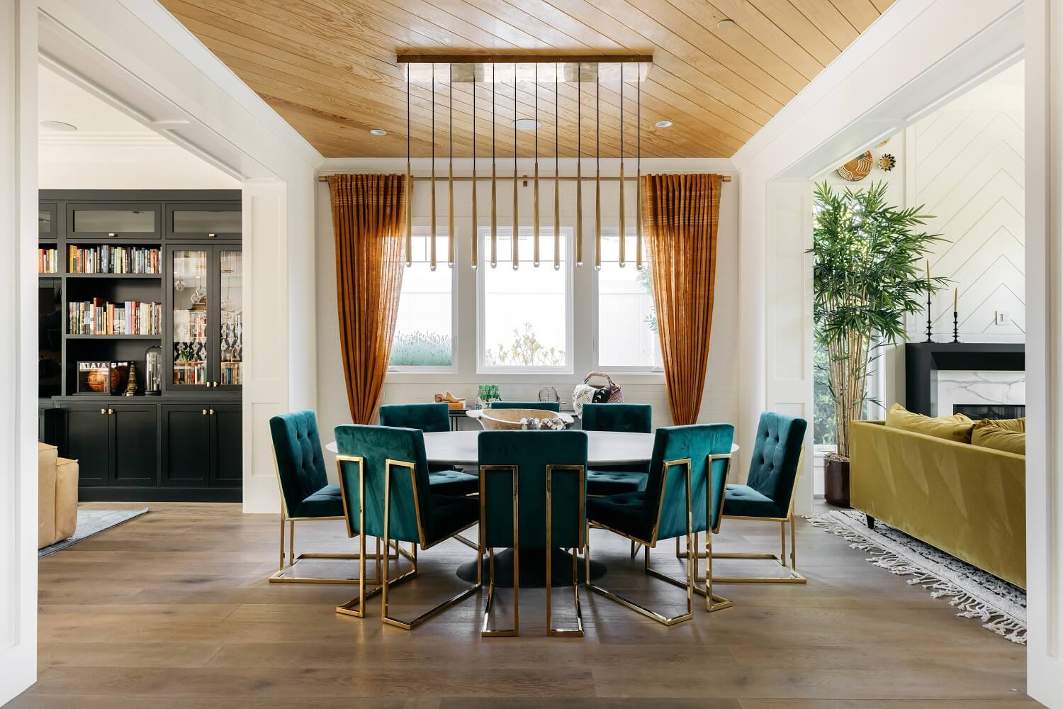 round-dining-table-green-velvet-chairs-daveed-diggs-emmy-raver-lampman-nordroom