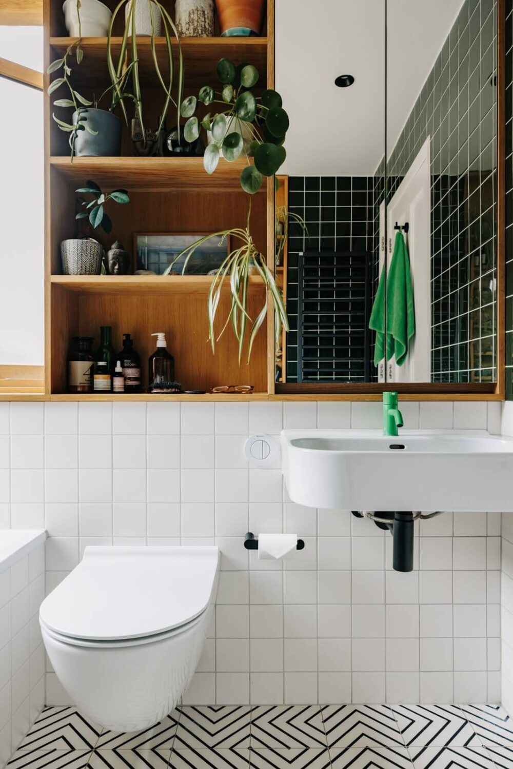 bathroom-green-tiles-built-in-cabinet-above-toilet-nordroom