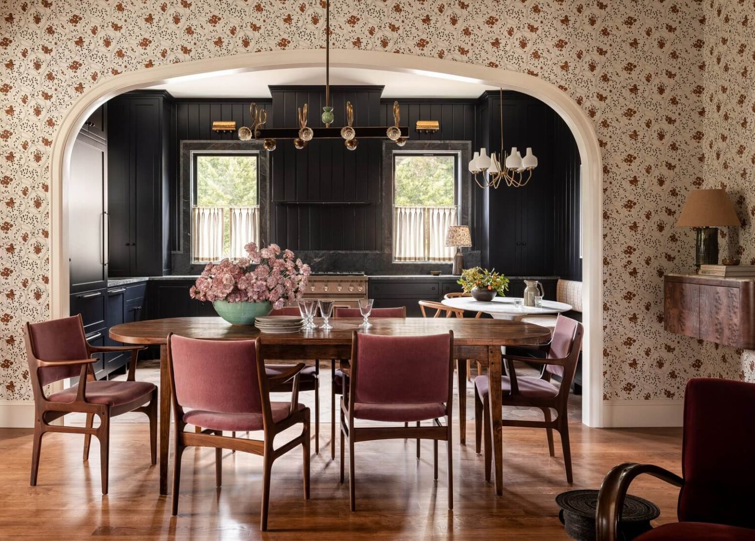 dining-room-arched-doorway-pink-velvet-chairs-floral-wallpaper-nordroom