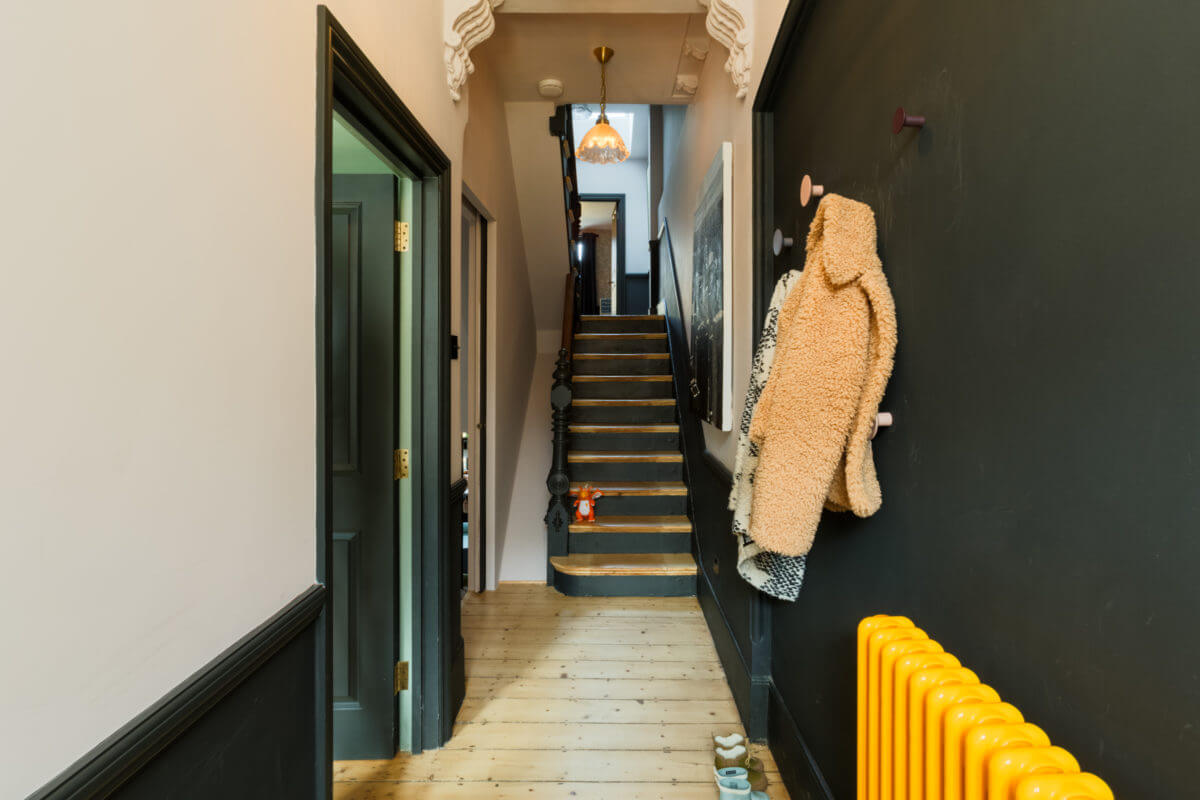 hallway-black-wall-yellow-heating-nordroom