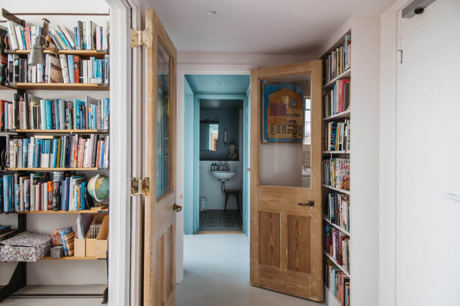 hallway-london-apartment-brick-walls-bookshelves-nordroom