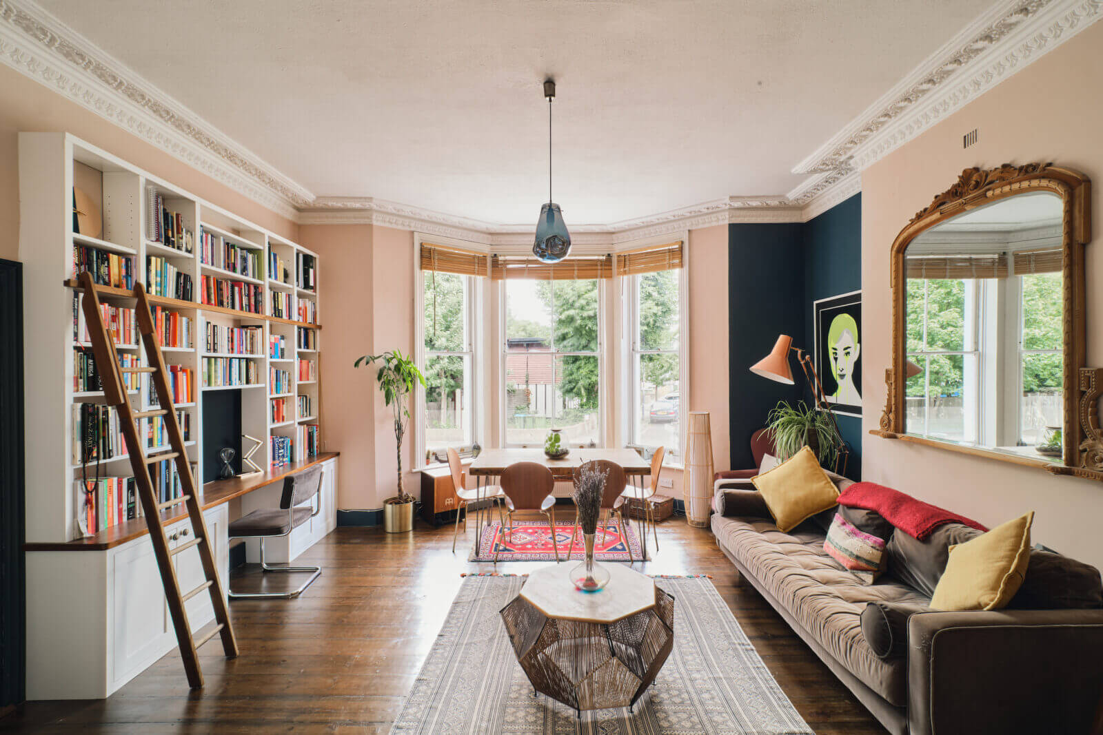pink-sitting-room-blue-accent-wall-bookcase-desk-nordroom