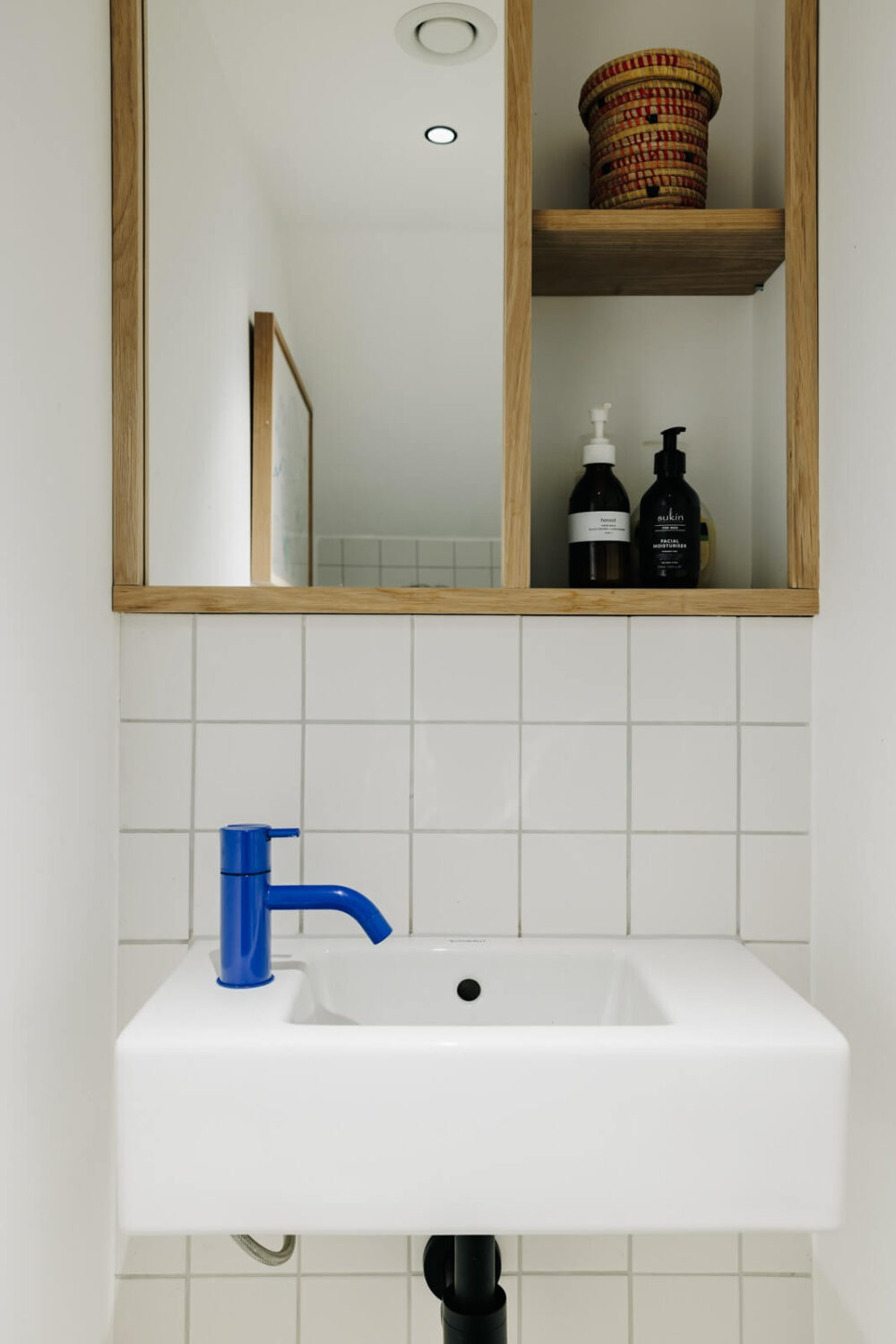 powder-room-small-sink-blue-faucet-nordroom