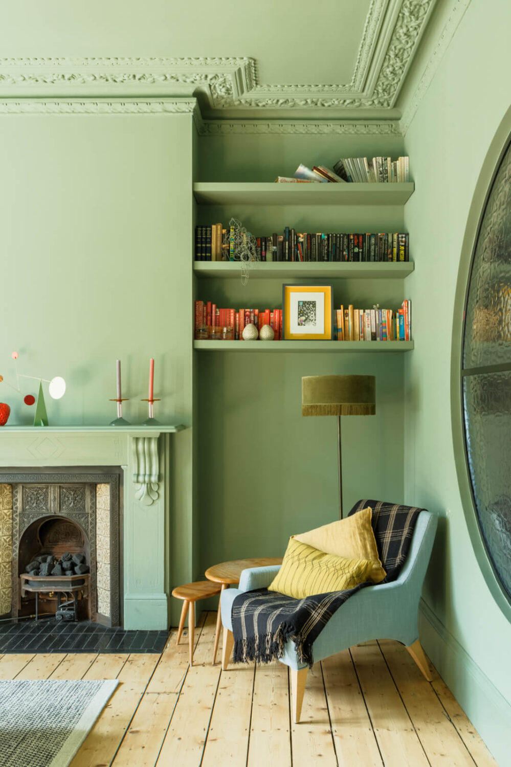 reading-nook-shelves-fireplace-green-sitting-room-wooden-floor-nordroom