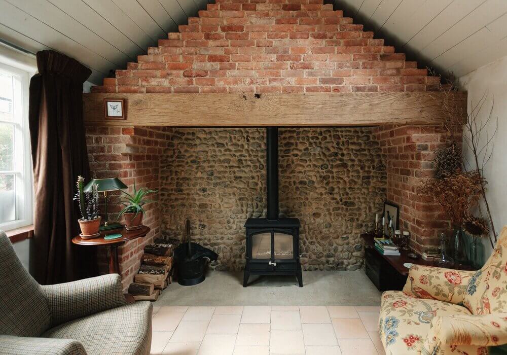 sitting-room-sloped-ceiling-stone-fireplace-nordroom