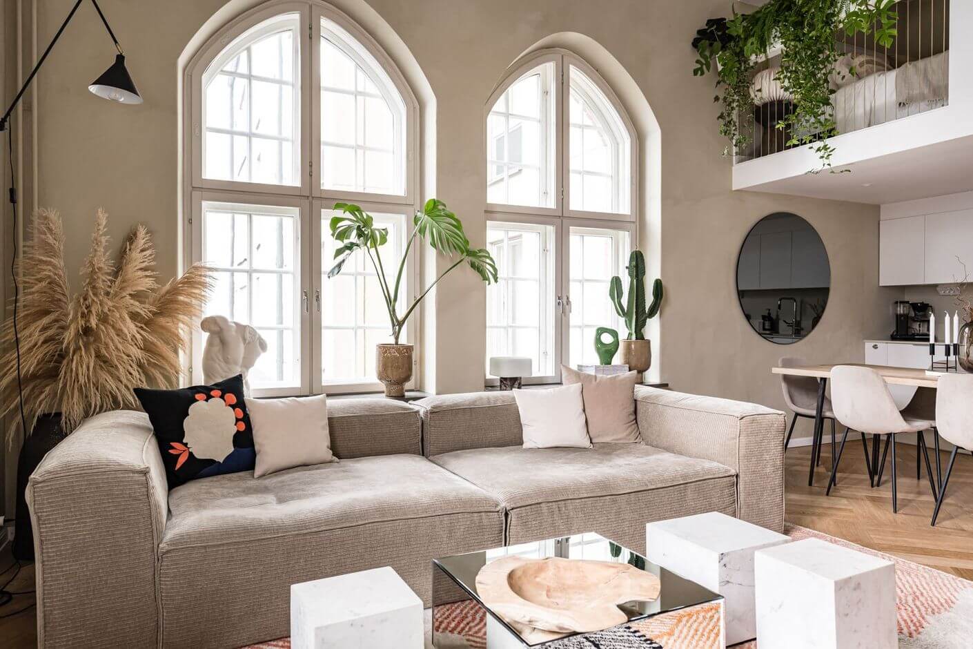 arched-windows-loft-living-room-gray-sofa-nordroom