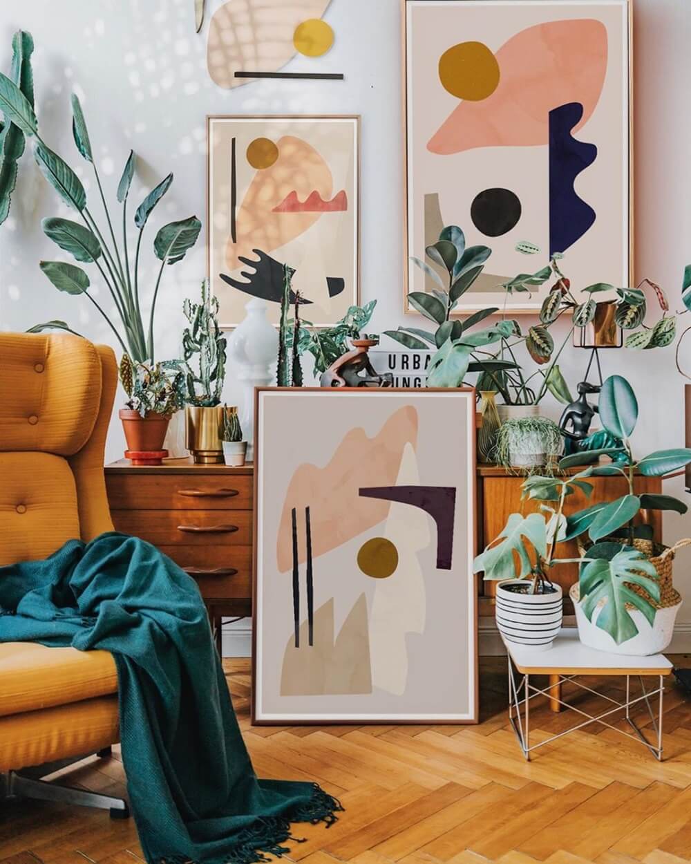 art-plants-living-room-ochre-chair-teal-throw-nordroom