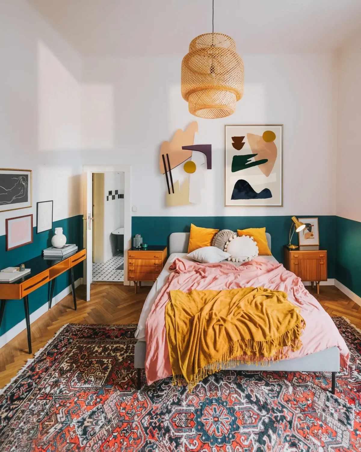 bedroom-half-painted-teal-wall-ochre-pink-bedding-large-rug-nordroom