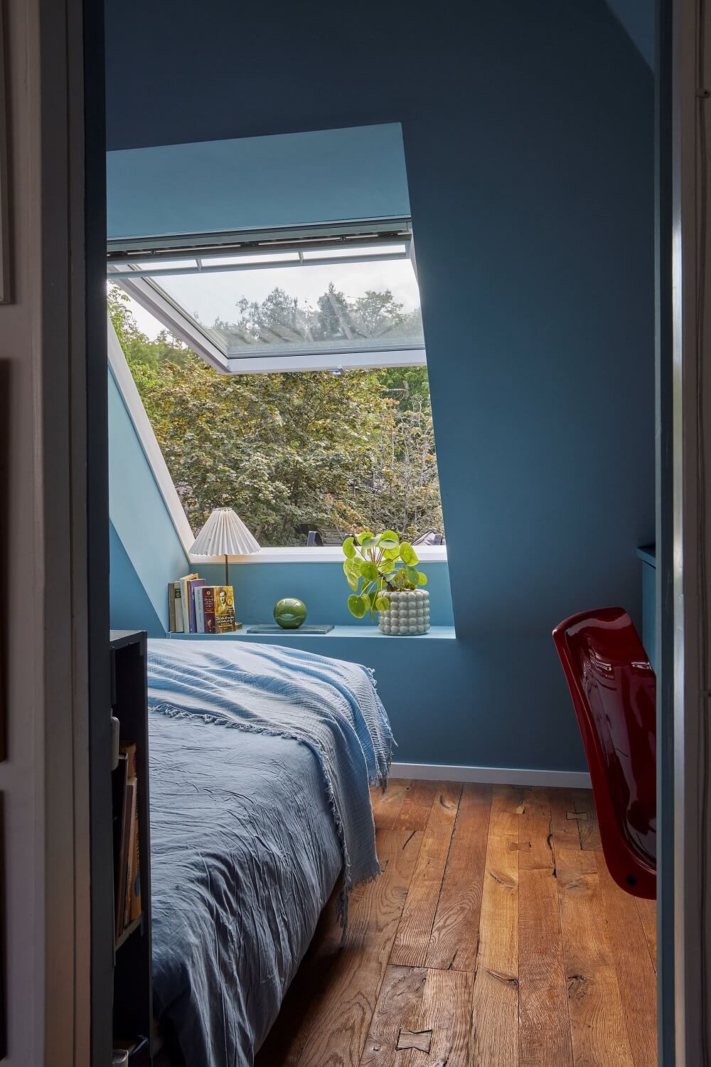 blue-attic-bedroom-large-window-wooden-floor-nordroom
