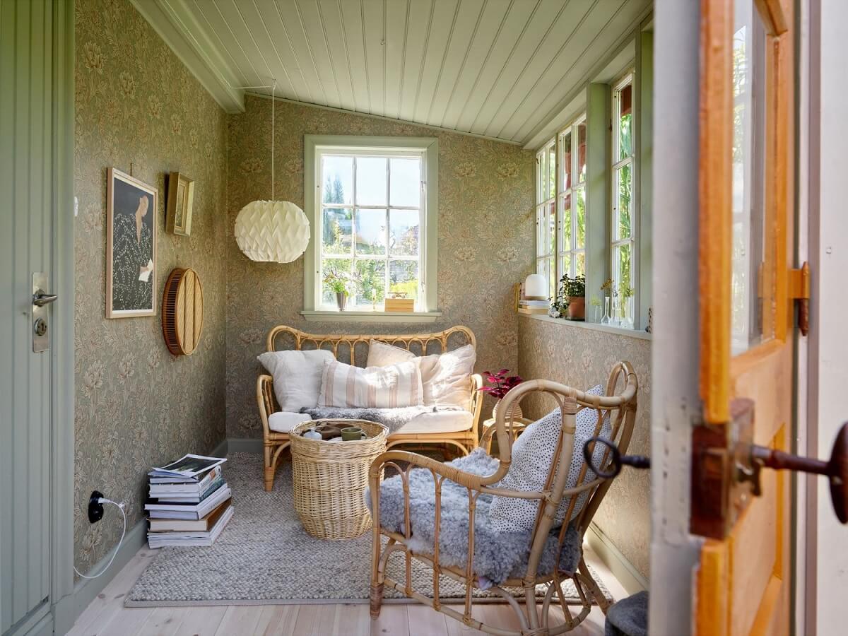 garden-room-swedish-summerhouse-rattan-furniture-wallpaper-nordroom