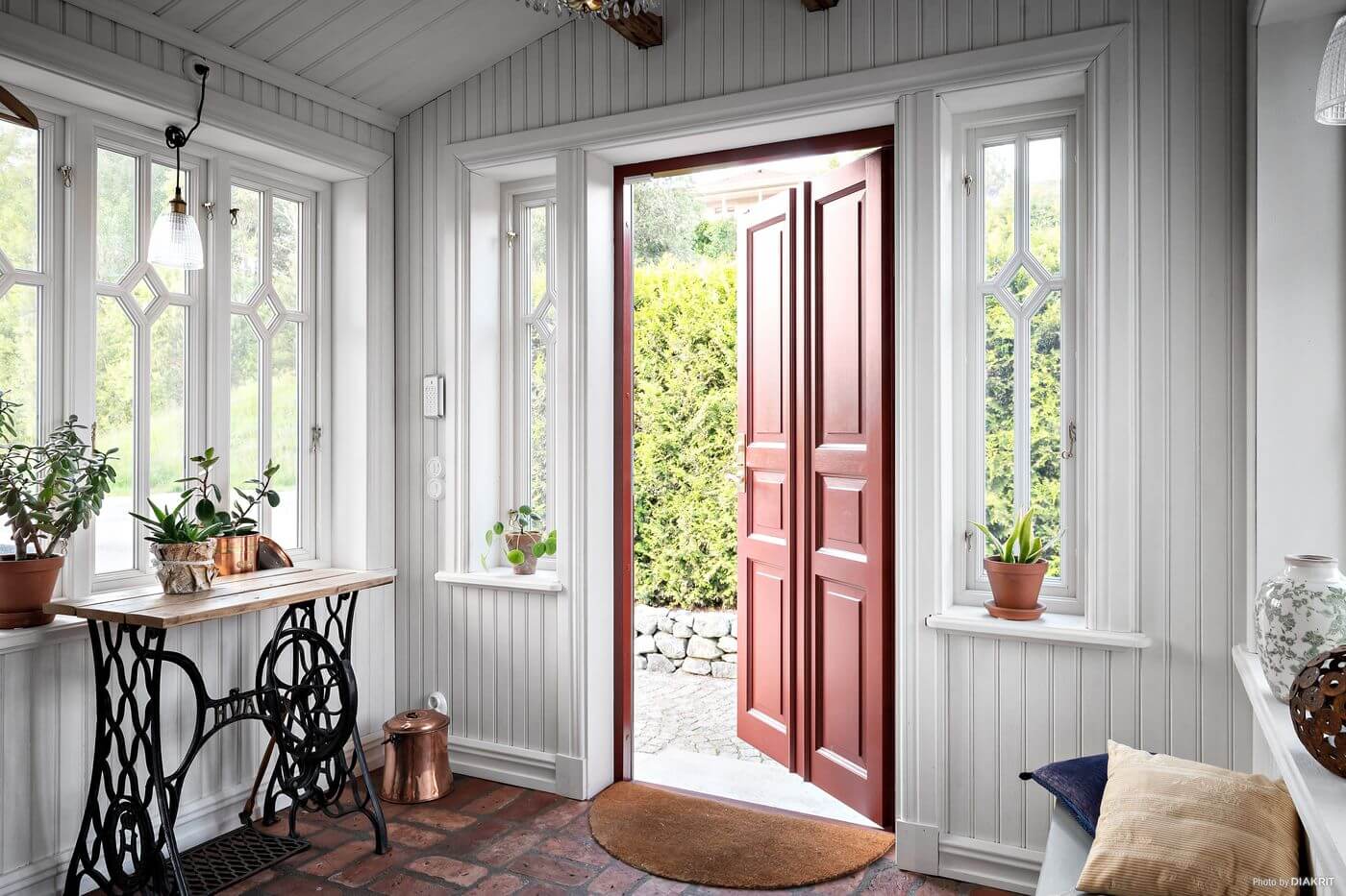 hallway-red-wooden-door-swedish-country-house-nordroom