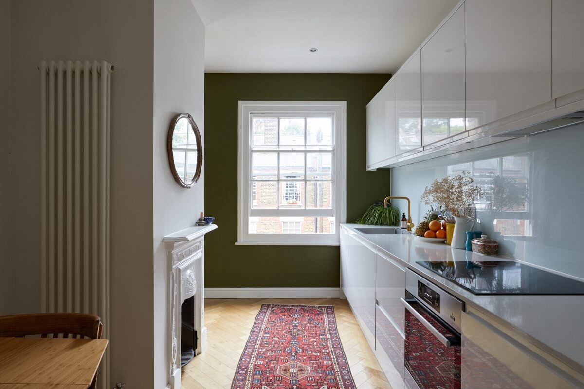 kitchen-modern-white-cabinets-olive-green-wall-fireplace-nordoom