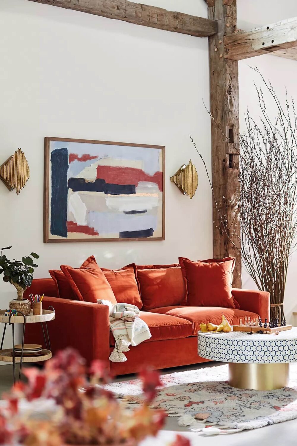 living-room-exposed-wooden-beams-orange-sofa-teal-coffee-table-nordroom