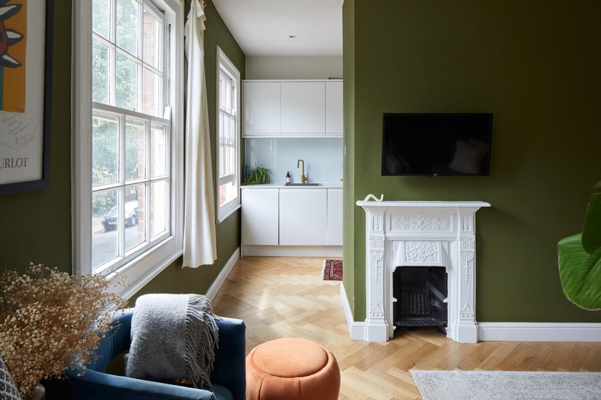 living-room-olive-green-walls-white-fireplace-nordroom