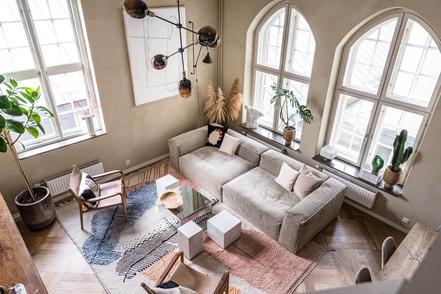 A Historic Factory Transformed Into A Stylish Home 1 serene-scandinavian-living-room-arched-windows-nordroom