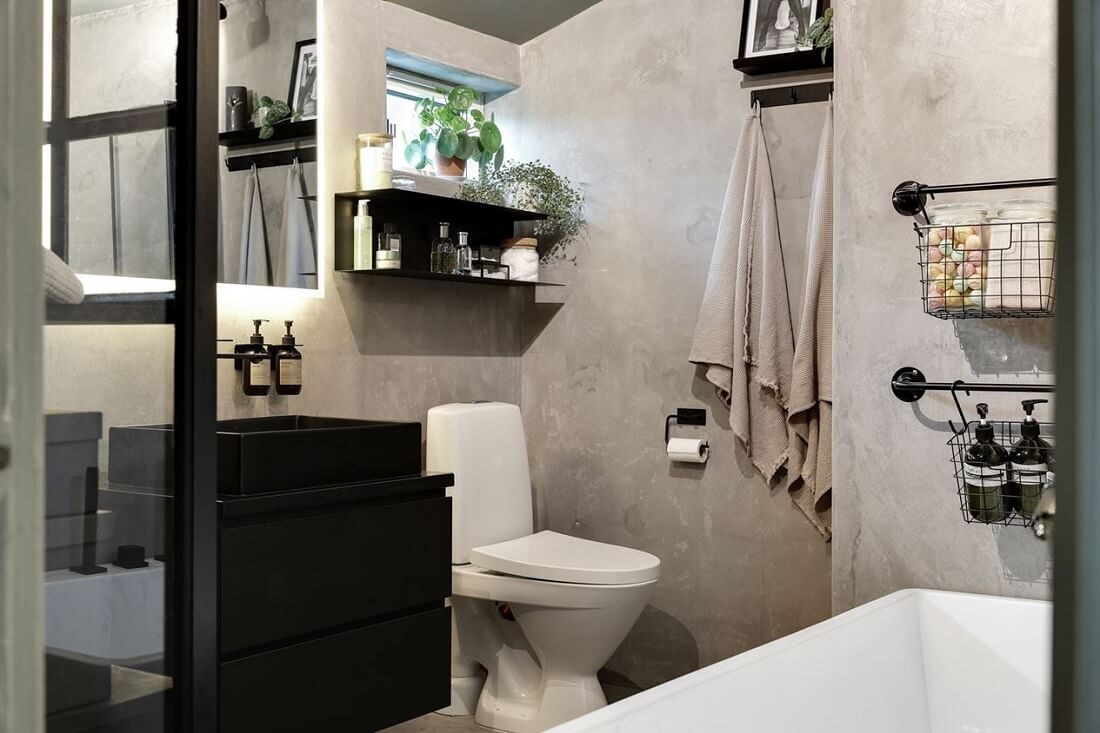 small-bathroom-limestone-walls-black-fittings-nordroom