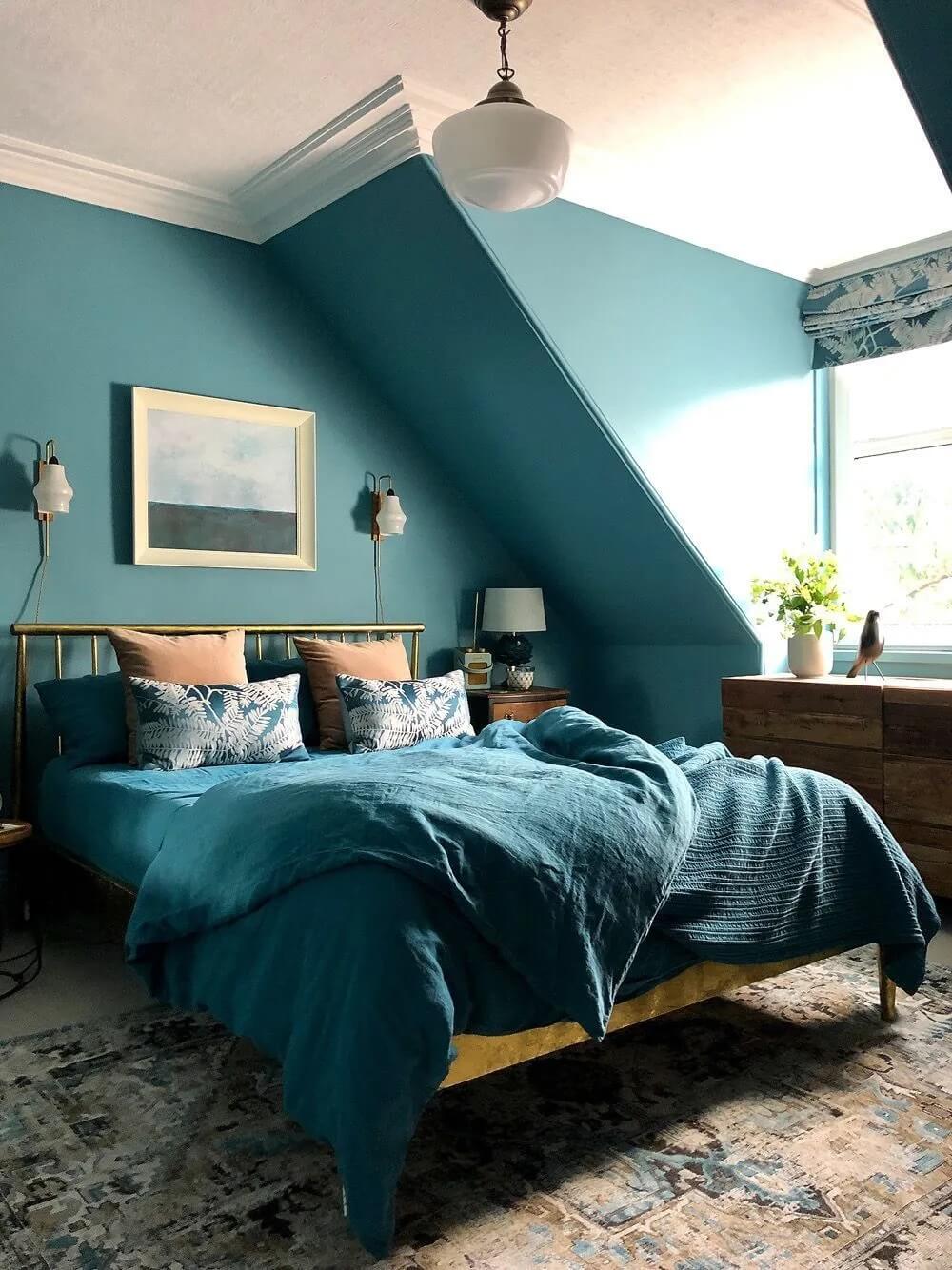 teal-bedroom-walls-bedding-sloped-ceiling-earthy-color-accents-nordroom