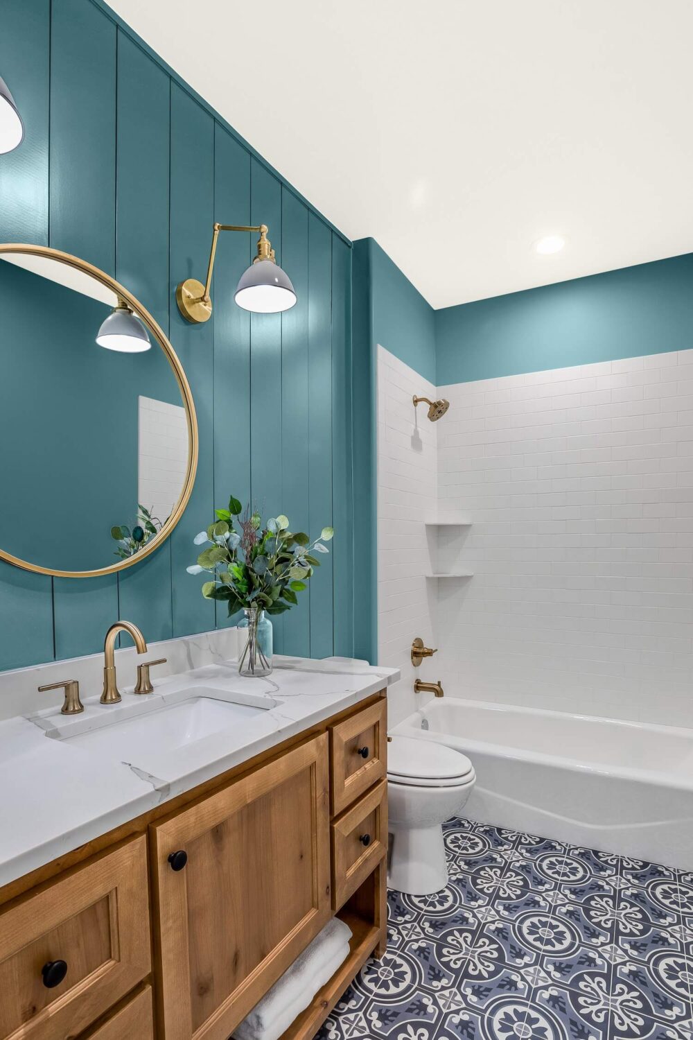 bathroom-teal-colored-wood-panels-round-mirror-bath-nordroom