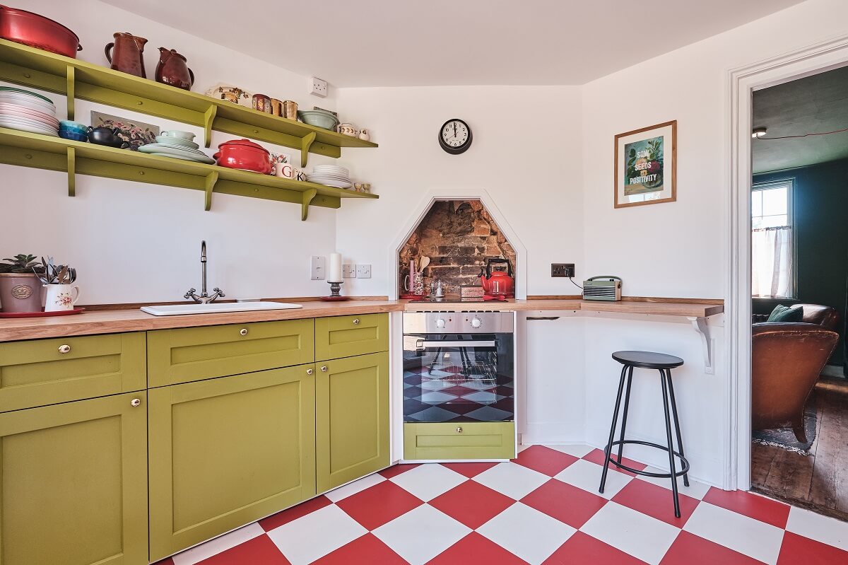 green-kitchen-cabinets-shelves-red-white-checkerboard-floor-nordroom