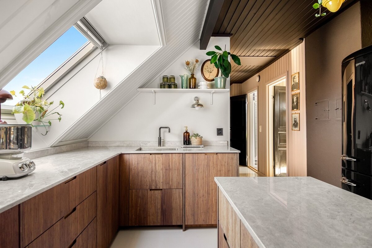 modern-wooden-kitchen-slanted-ceiling-earthy-colored-wall-nordroom