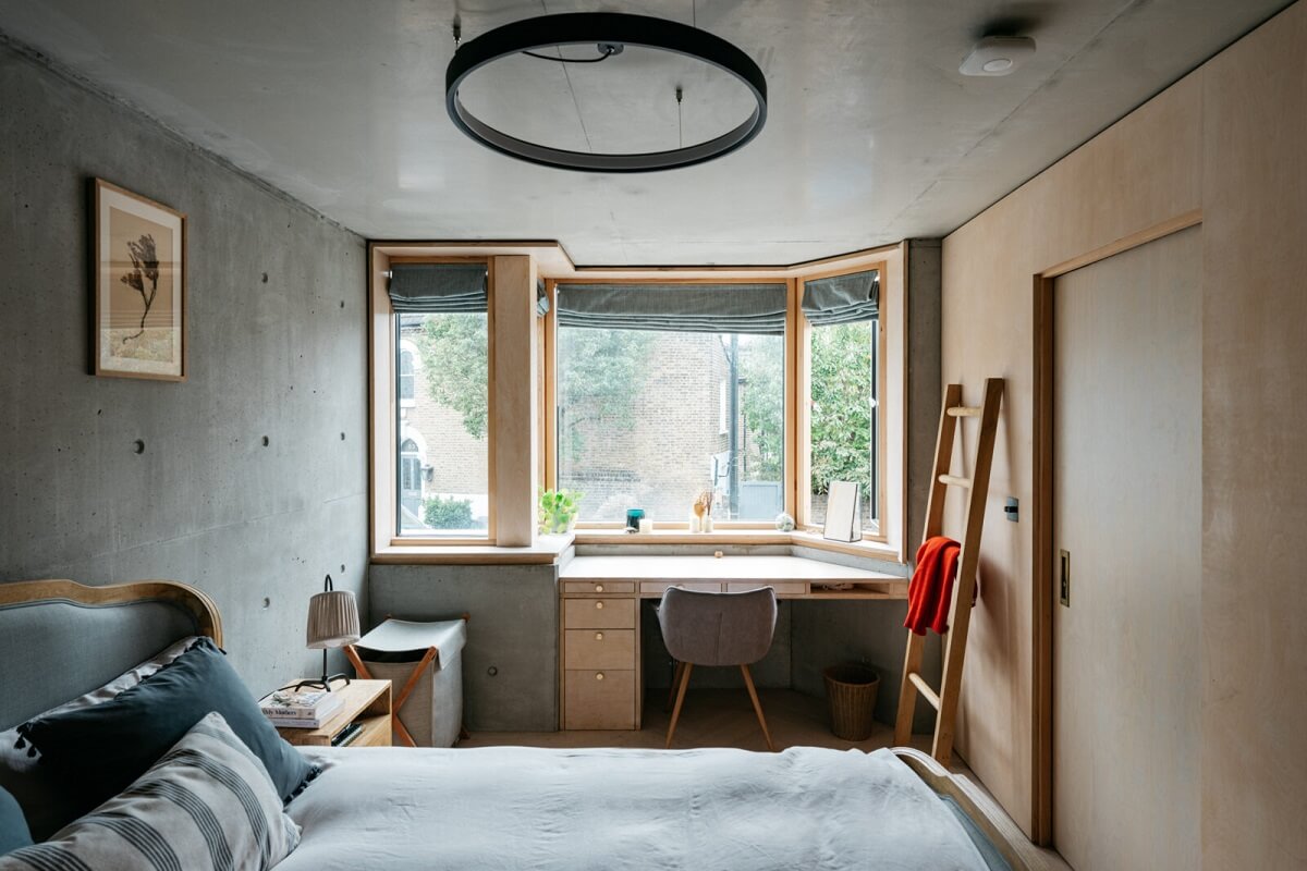 bedroom-bay-window-home-office-concrete-walls-nordroom