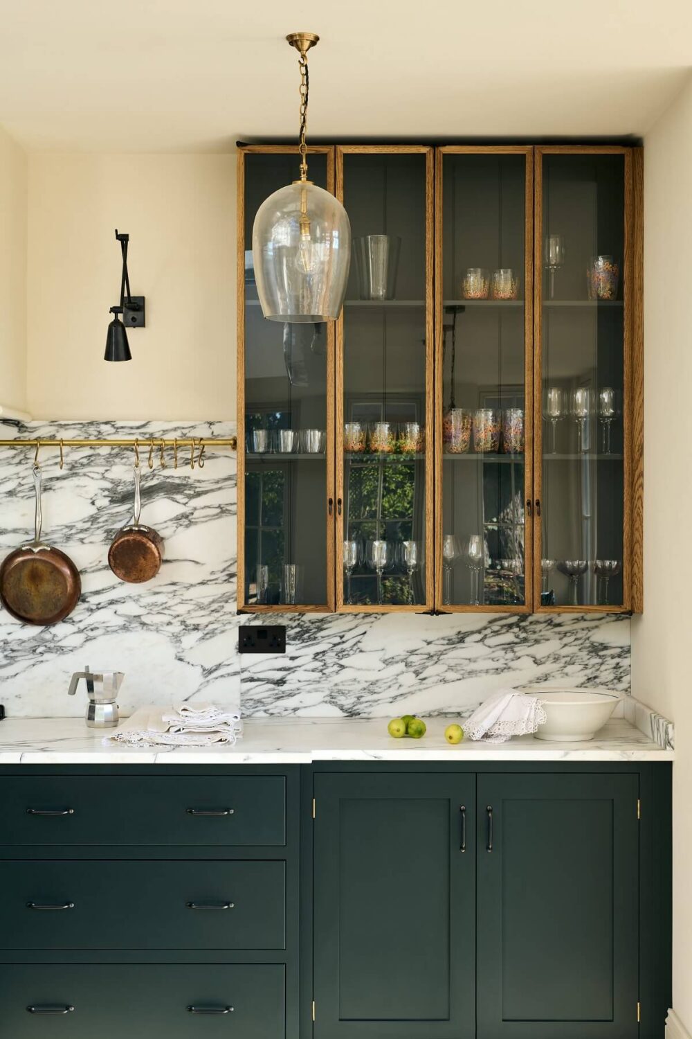 dark-green-shaker-kitchen-cabinets-glass-cabinet-marble-worktop-nordroom