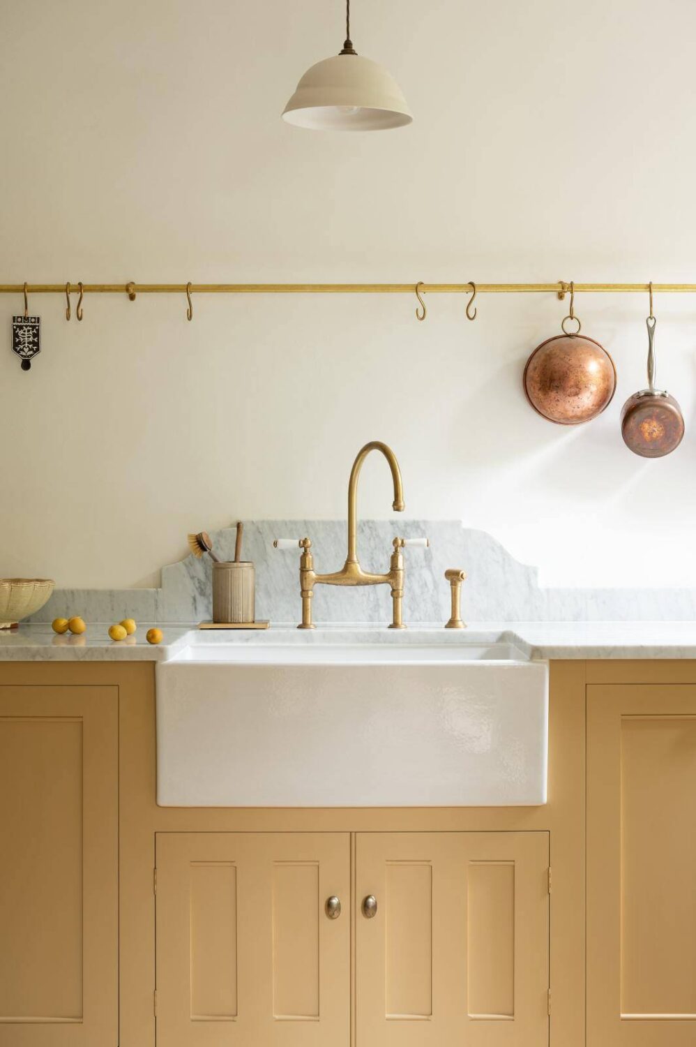 devol-kitchen-hanging-rails-yellow-cabinets-nordroom