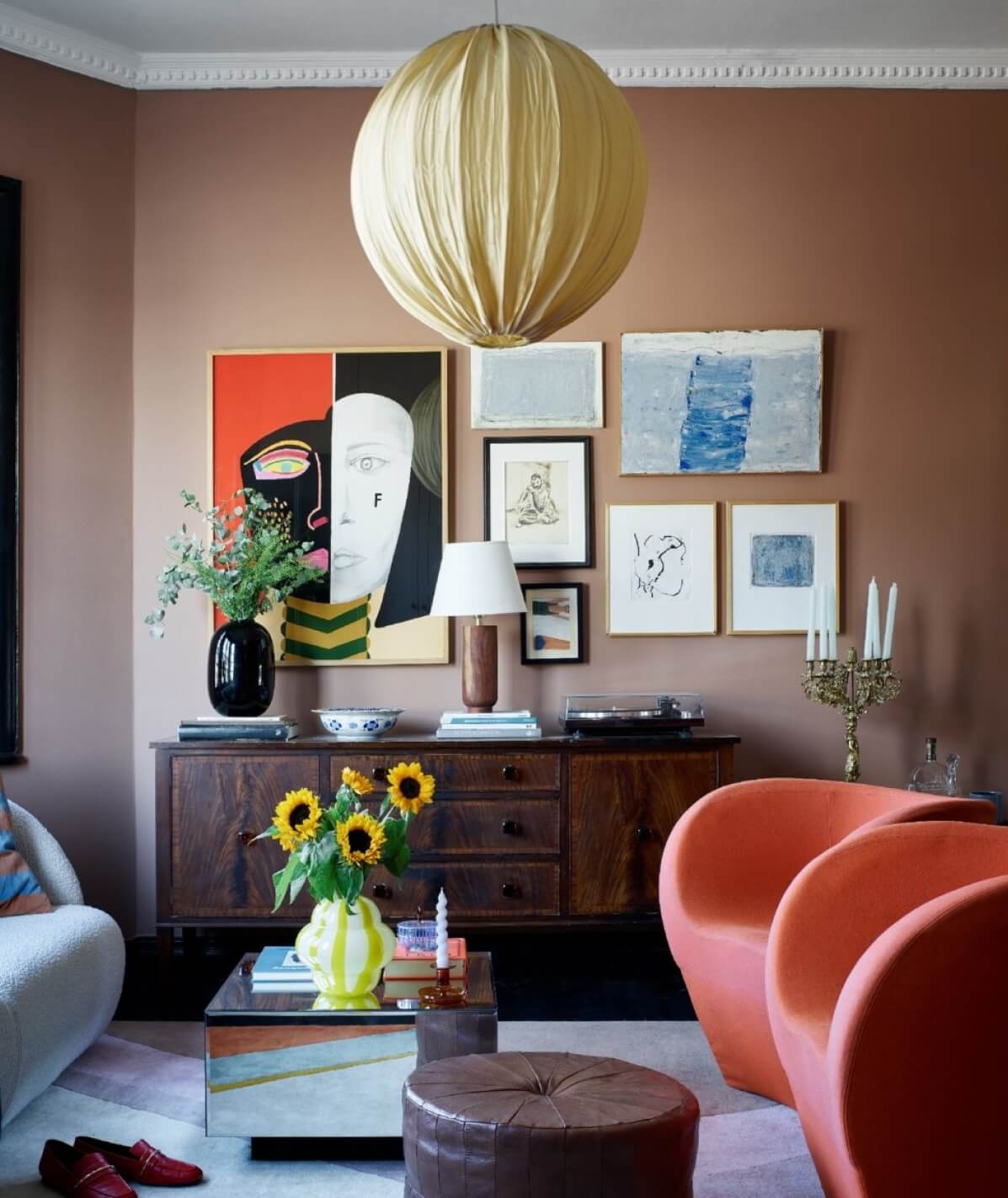 dusty-pink-living-room-orange-armchairs-gallery-wall-nordroom