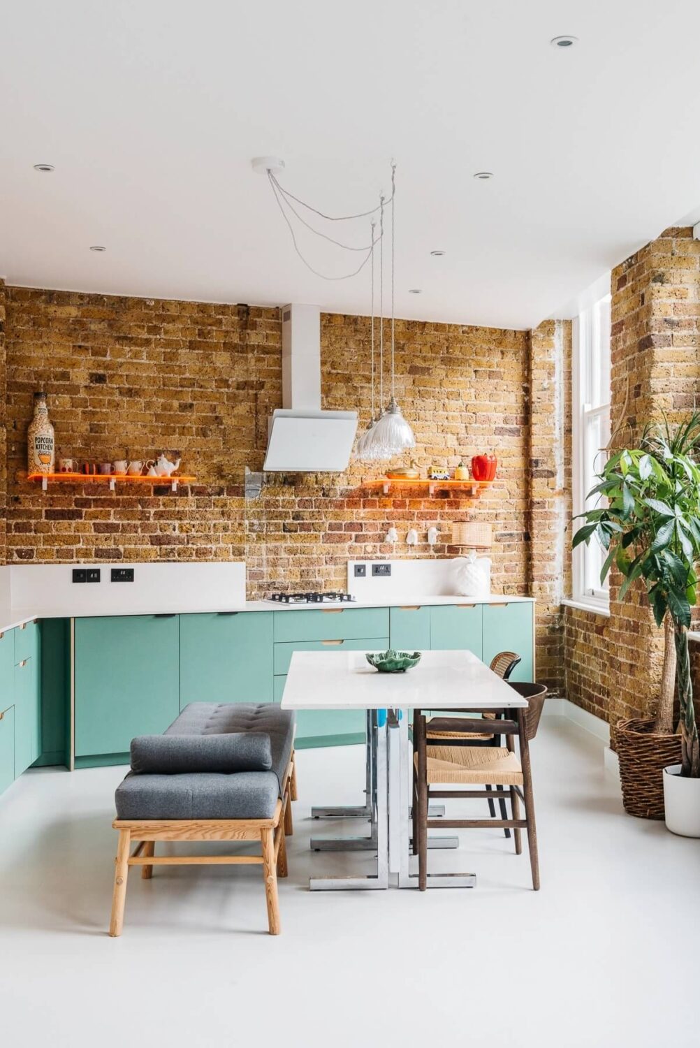 kitchen-pale-green-cabinets-exposed-brick-walls-warehouse-apartment-london-nordroom