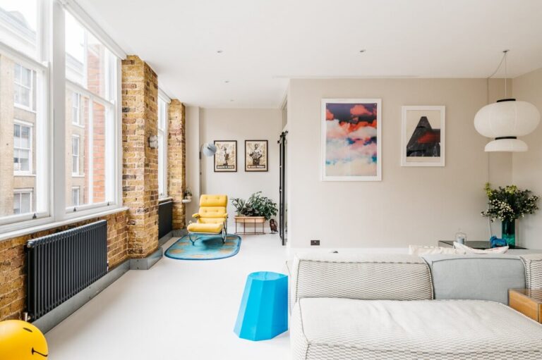A Modern Apartment with Exposed Brick Walls and Color Accents - The ...