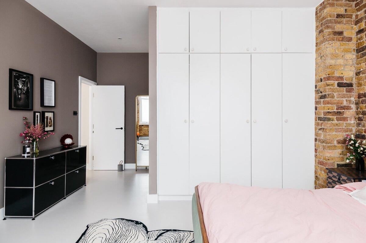 master-bedroom-brick-walls-white-wardrobes-nordroom