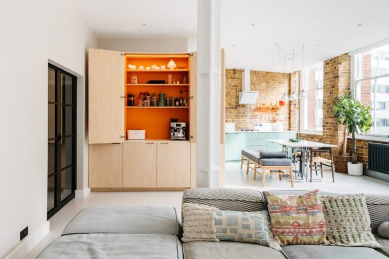 Image showcasing A Modern Apartment with Exposed Brick Walls and Color Accents - The ...