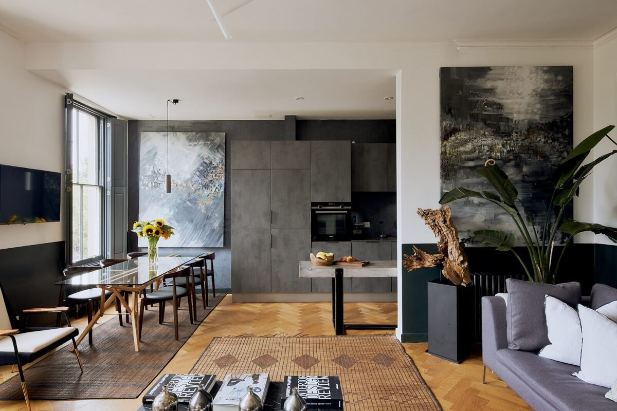 open-plan-living-room-kitchen-gray-cabinets-hardwood-floor-nordroom