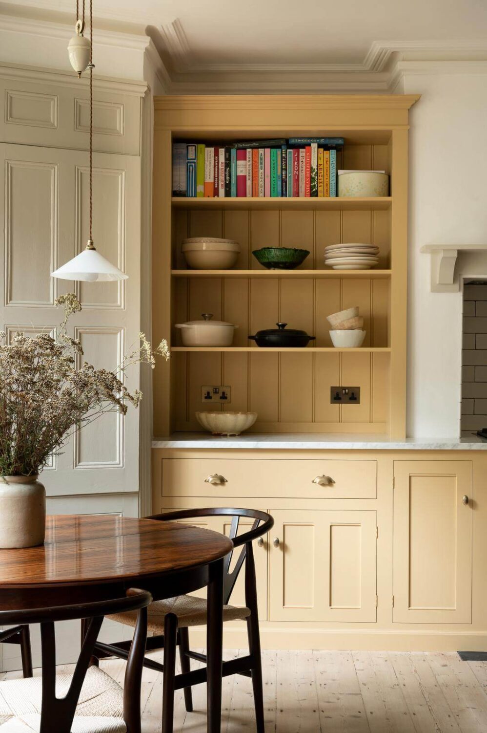 round-kitchen-table-yellow-cabinets-nordroom