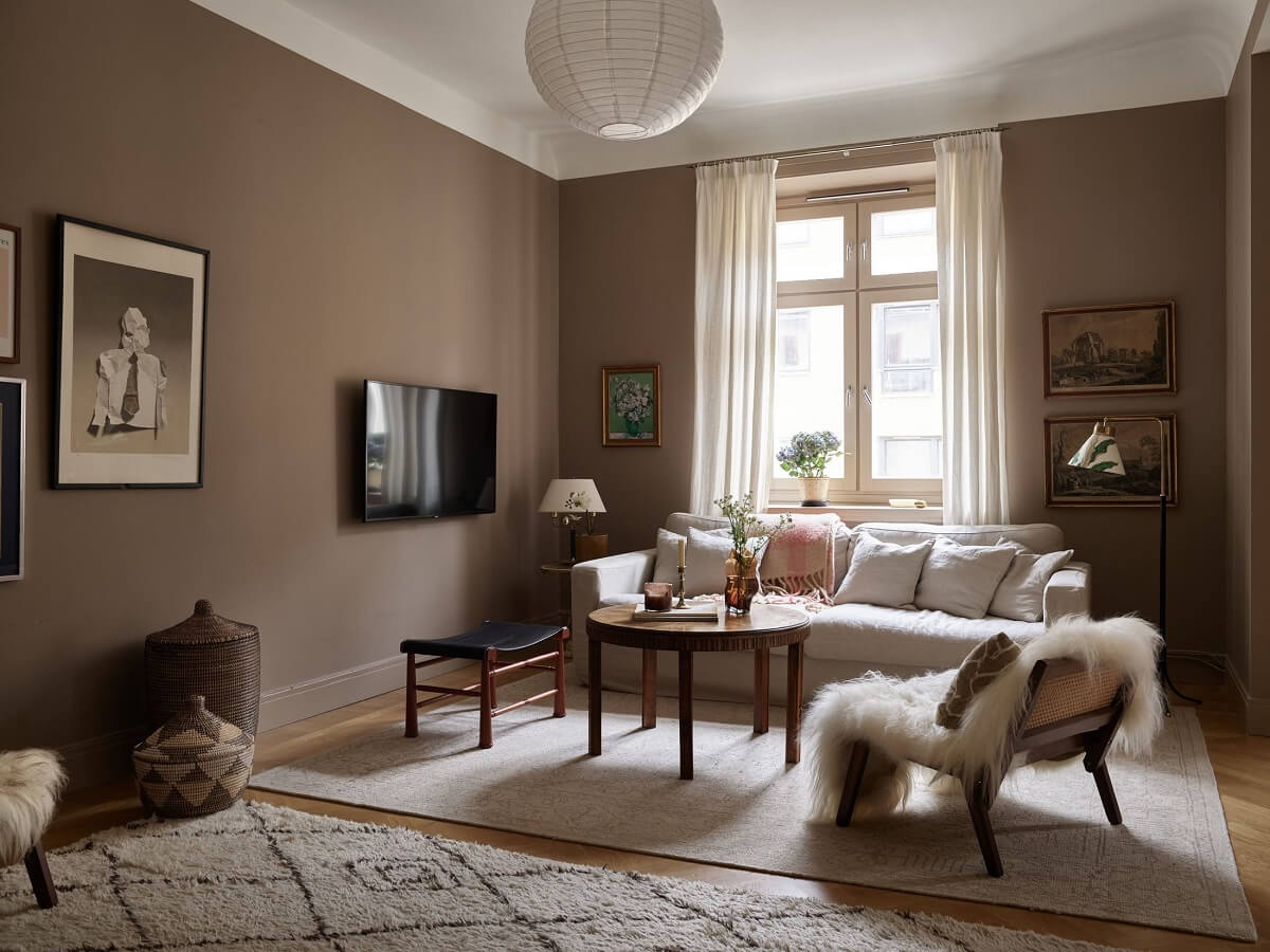 warm-sitting-room-light-brown-walls-white-sofa-nordroom