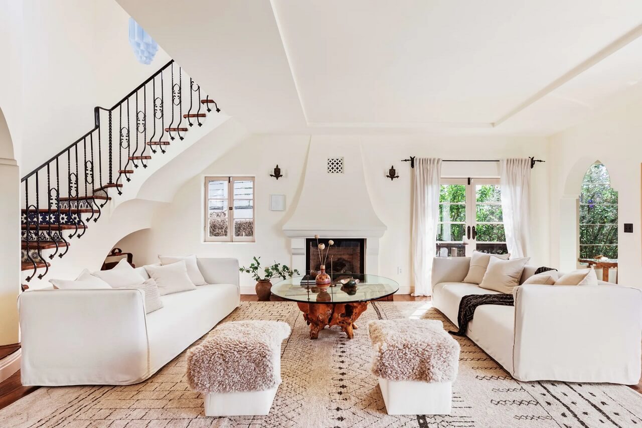 white-living-room-couch-fireplace-open-staircase-nordroom